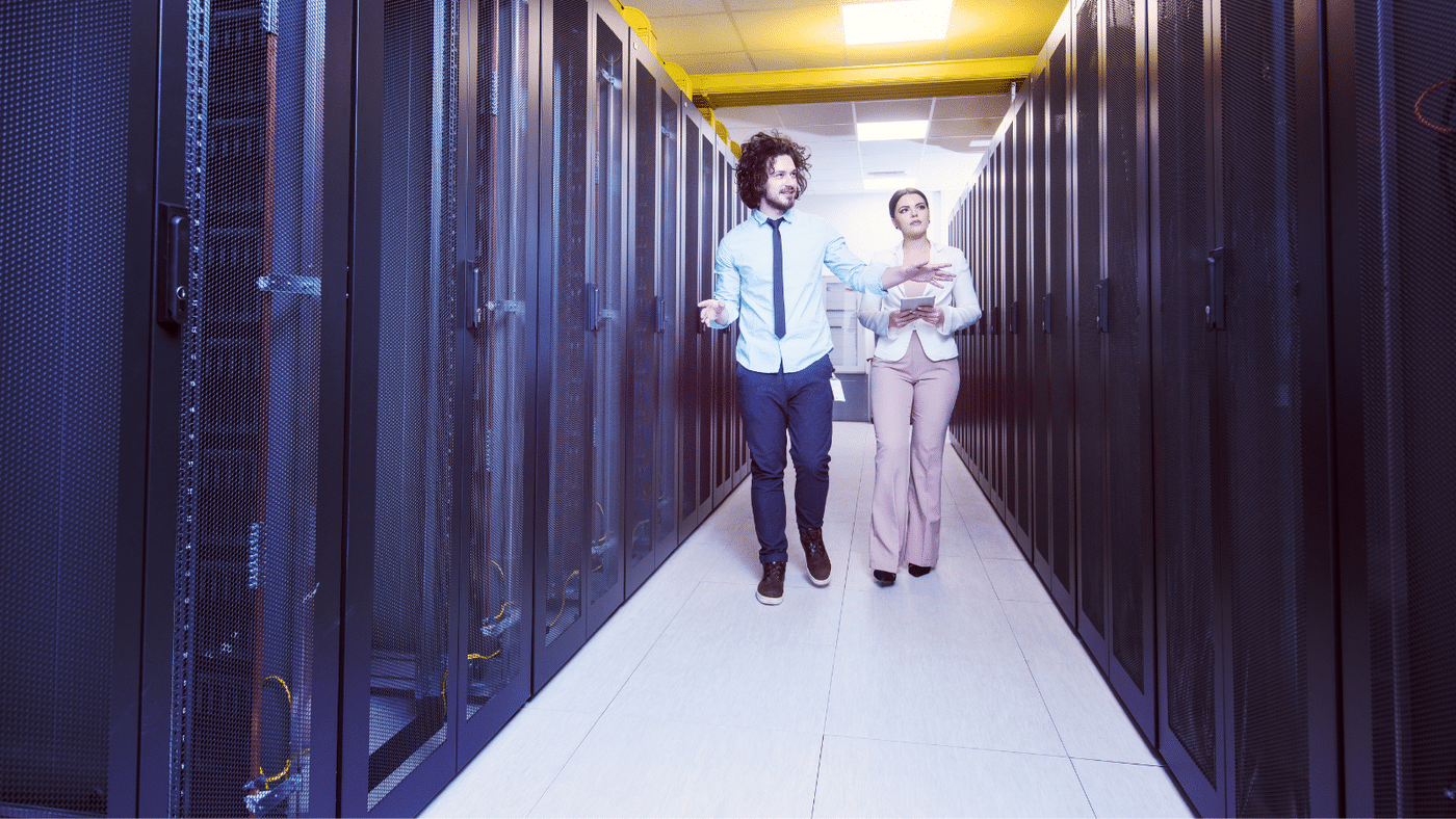 Enterprise data storage solutions with Internetwork Engineering. Image showing man and woman walking through their software defined data storage in their modern data center. This image shows the data security and accessibility of a modern enterprise storage solution.